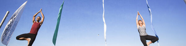 Two People Practicing Yoga