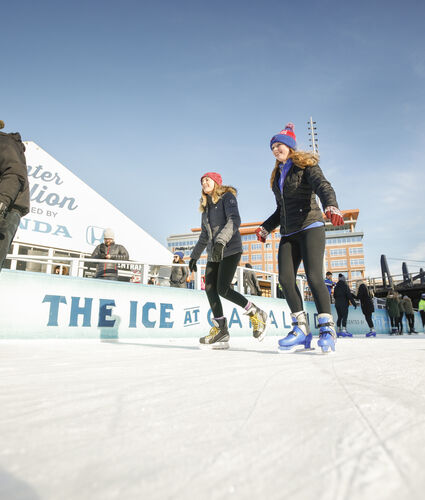 Girls Skating on Community Ice Rink
