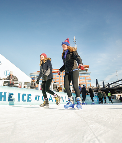 Two girls ice skating