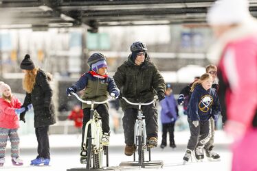 Enlarge image: Two People On Ice Bikes
